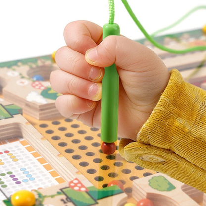 Montessori Magnetic Maze Puzzle Toy with a baby playing with them.